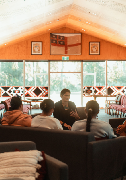 Group of tamariki listening to Dr Hana O'Regan