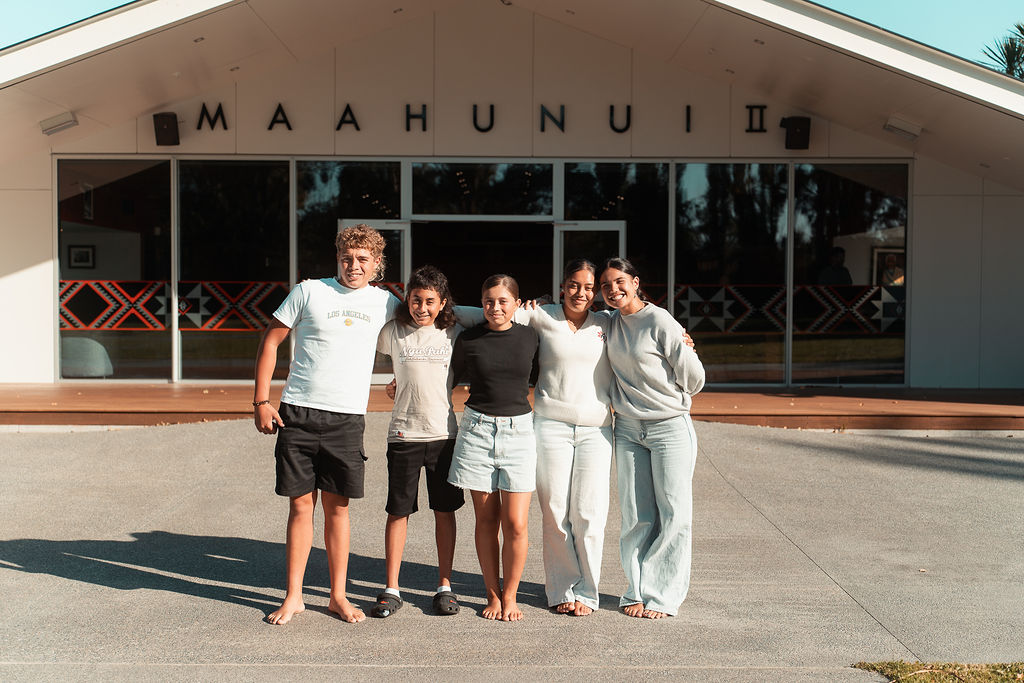 Group of tamariki smiling at camera