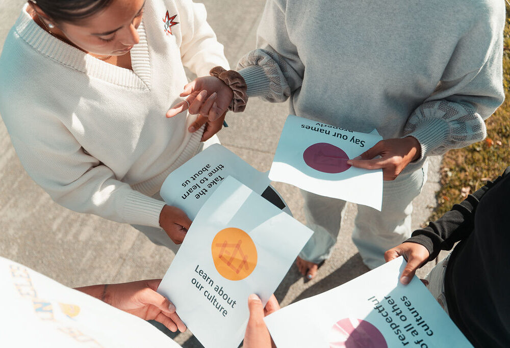 Tamariki holding the Charter principles